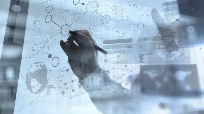 businessman hand working with modern technology and digital layer effect as business strategy concept 16-9