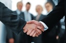 Handshake in front of business people